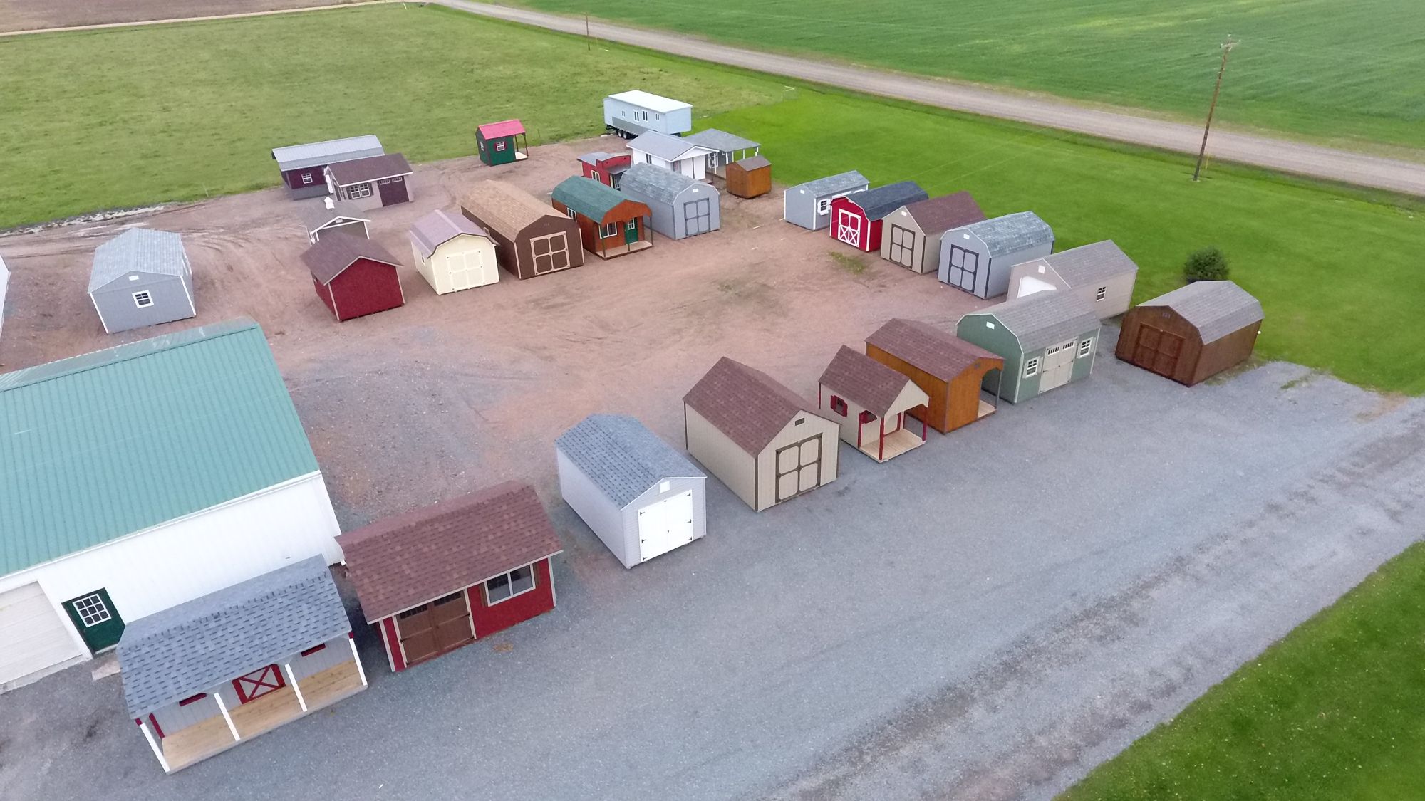 https://www.shedsdelivered.com/wp-content/uploads/2019/07/portable-shed-manufacturing-facility-lot-in-wisconsin.jpg