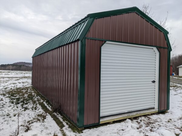12x30 lofted garage earth brown siding - green trim 8x7 white rollup door