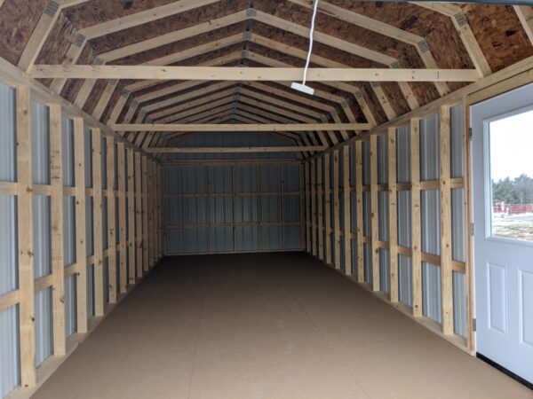 12x32 lofted garage cobblestone siding-roof-rawhide 8x7 white rollup door-right